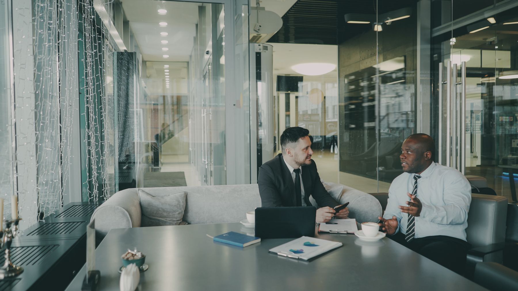 Senior executives discussing strategy in a contemporary office